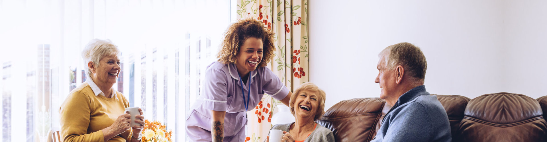 beautiful caregiver and senior man are smiling